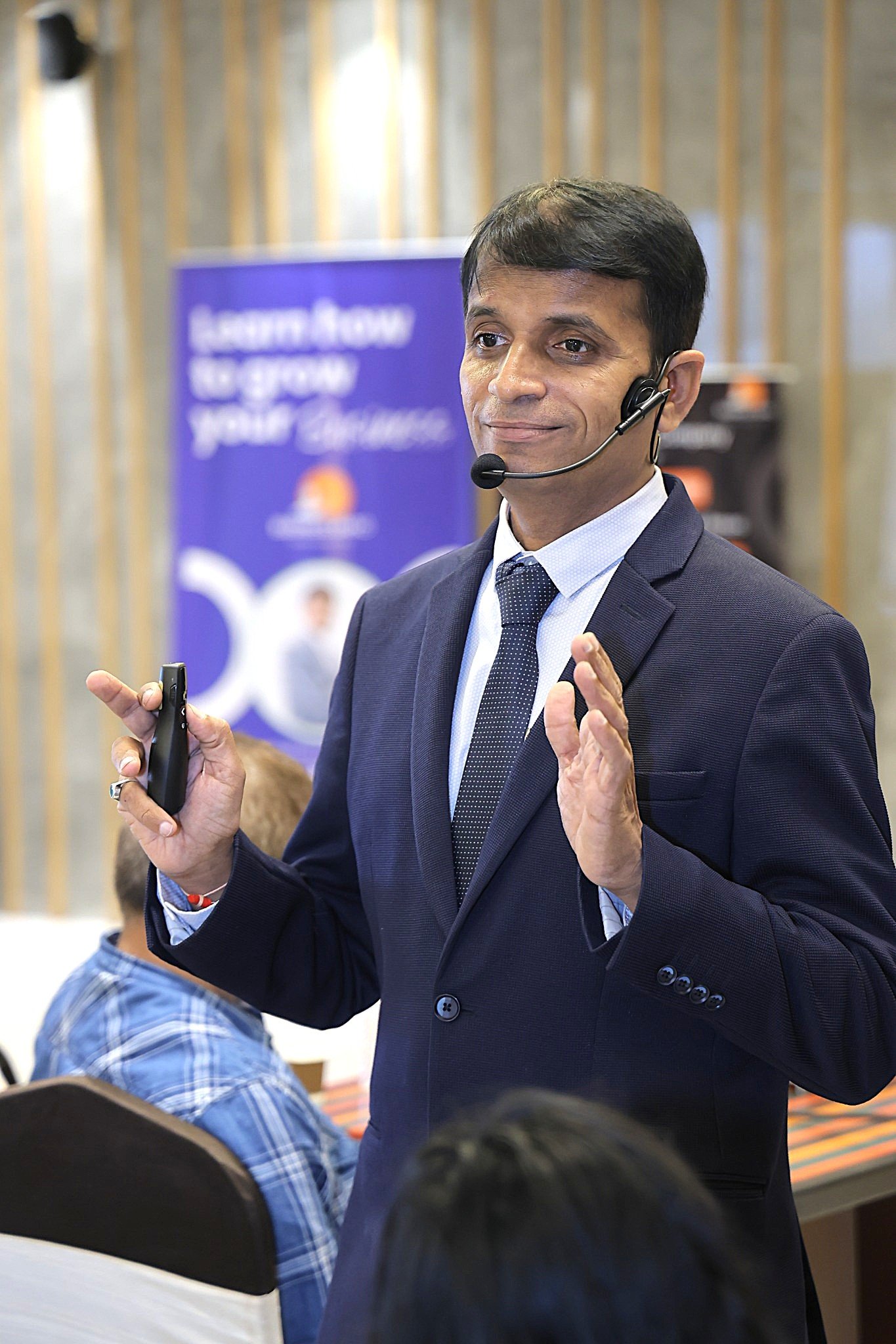 Vijay Patel speaking at a business session